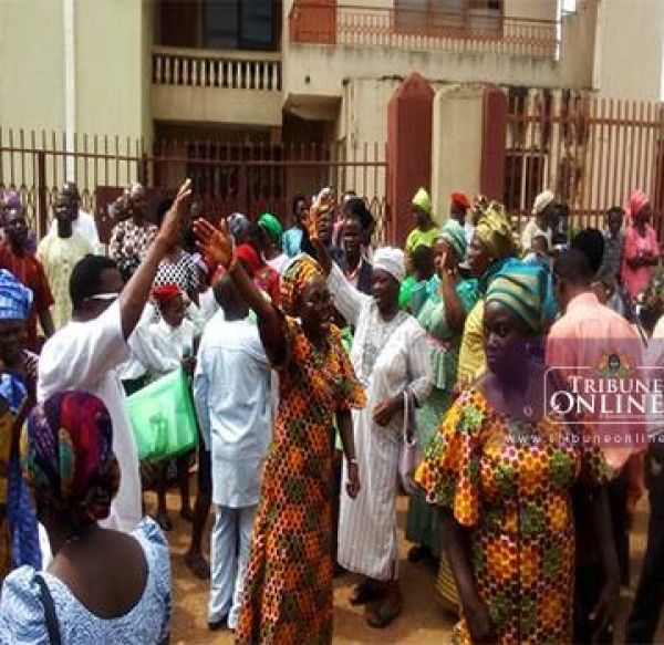 •Ajegunle Baptist Church, Agbowo, Ibadan, members outside the church house on Sunday.