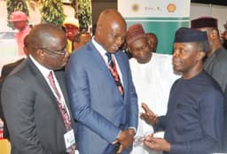 L-R: Managing Director, Shell Nigeria Exploration and Production Company, Bayo Ojulari; and the Managing Director, The Shell Petroleum Development Company of Nigeria (SPDC) Ltd and Country Chair, Shell Companies in Nigeria, Osagie Okunbor, receiving Chairman, Nigeria Economic Summit Group, Bukar Kyari and the Vice President, Prof. 'Yemi Osinbajo at the Shell exhibition stand at the opening of the 23rd Nigeria Economic Summit in Abuja... on Tuesday, Oct. 10, 2017.