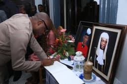 Honourable Minister of Transportation, Rt. Hon. Chibuike Rotimi Amaechi, signing the condolence register in honour of the Late Rivers State Attorney-General and Commissioner of Justice, Emmanuel C. Aguma at his residence in Ogbunabali, Port Harcourt, Rivers State, on August 14, 2018.