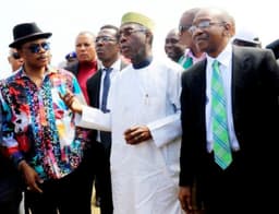 L-R Anambra state Governor, Chief Willy Obiano, Minister of Agriculture, Chief Audu Ogbe, CBN Governor, Mr Godwin Emefiele during the inspection tour of the Rice farms under the Anchor Borrowers Programme in Anambra state on Thursday, October 19, 2016. 