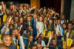Managing Director/Chief Executive Officer, Fidelity Bank Plc, Nnamdi Okonkwo flanked by the  President, Africaâ€™s Young Entrepreneurs (AYE), Summy Smart Francis (L),  Vice President, AYE, Miss Ibada Ahmed (R)  and AYE beneficiaries at the Networking With Giants Conference (NWG) themed: Solution To Poverty In Africa sponsored by Fidelity Bank Plc in Lagos recently.