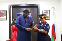 Bayelsa State Governor,Hon. Seriake Dickson (Left), presents a Special Souvenir to the visiting Commandant, Nigerian Security and Civil Defence Corps, Bayelsa State Command, Commandant Christiana Abiakam-Omanu, during a Courtesy call in the Government House, Yenagoa, on Monday, Aug. 6, 2018. Photo by Reginald Dei.
