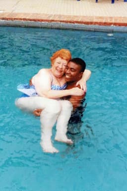 CJ Nwachukwu carries Angela.