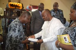 AKPABIO CONDOLES NSIKAK EDUOK: Governor Godswill Akpabio of Akwa Ibom State handing over his message of condolence to former Chief of the Air Staff, Air Marshall Nsikak Eduok (rtd.), during the funeral service of Air Marshall Eduokâ€™s wife, the late Mrs. Nkese Nsikak Eduok, yesterday, Nov. 16, 2012.