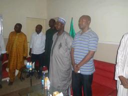 ALL FOR SUPER EAGLES . . . Gov. Mukhtar Ramalan Yero (second from right) with the Chairman of the NUJ, Kaduna State Chapter, standing during the Nigerian National Anthem on TV to commence the Nigeria/B.Faso AFCON final in South Africa won 1-0 by Nigeria . . . on Sunday, Feb. 10, 2013.