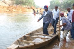 DARING: Governor David Umahi of Ebonyi State about to cross the Okawu-Abaomege River to inspect the ongoing construction of a bridge across the river ...on Saturday, Feb. 25, 2017.
