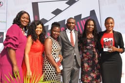 The author and some of the ladies profiled in Ladies Calling The Shots displaying the book during the launch in Lagos, on Nov. 13, 2017.