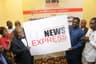 Chairman of the occasion, Chief Goddy Uwazurike (L) and Presidential Spokesman Femi Adesina displaying the new News Express logo while other dignitaries watch . . . on Thursday at Sheraton Hotel & Towers, Ikeja, Lagos.
