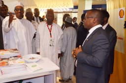 L-R: President Mohammadu Buhari; Chairman, Nigeria Economic Summit Group, Mr. Bukar Kyari; and  Head of Nigerian Content Development of Shell Nigeria Exploration and Production Company (SNEPCo), Mr. Austin Uzoka, during the presidentâ€™s tour of Shellâ€™s stand at the opening ceremony of the 2016 Nigeria Economic Summit in Abujaâ€¦ on Monday, Oct. 10, 2016.
