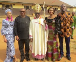 Archbishop Valerian Okeke (middle), flanked by Mr. Peter Obi (1st left); his daughter, Amaka (2nd left); wife, Margaret (2nd right) and son, Eloka (2nd right), after Christmas mass with prisoners at Onitsha prisons on Tuesday, Dec. 25, 2018.

