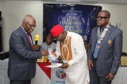 L-R: Past District Governor, Rotary International District 9110 Dr. Kamoru Omotosho presenting bannerette of Rotary Club of Ikoyi to the guest speaker, Sir (Egnr) Patrick Igwilo with the President of the Club, Rotarian Isichei Osamgbi after he delivered a lecture on â€˜Some Intellectual Underpinnings of Givingâ€™ at the Club recently in Westwood Hotel Lagos.