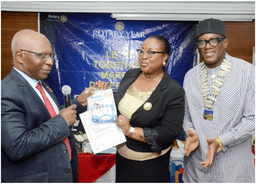 L-R: Past District Governor, Rotary International District 9110, Dr. Kamoru Omotosho presenting bannerette of Rotary Club of Ikoyi to the Guest Speaker, Dr (Mrs) Felicia Mogo, Deputy Director/Head Marine Environment Management Department, Nigeria Maritime Administration & Safety Agency (NIMASA) with the President, Rotary Club of Ikoyi, Rotarian Isichei Osamgbi after she delivered a lecture on "The Environmental pollution in Nigeria" at the Club recently in Lagos.