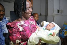 Deaconess Roli Nere Uduaghan, wife of Governor Emmanuel Uduaghan of Delta State, carrying the Star Baby of the Year. The Baby girl, born to the family of Mr. & Mrs. Pascal at exactly 12:01 a.m. at Central Hospital Warri, on the January 1, 2014, weighed 3.6Kg.