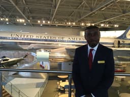 Sam Okey Mbonu at reagan library with airforce one background.