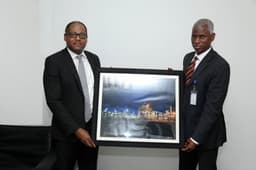 Managing Director, Shell Nigeria Gas, Ed Ubong (left) making a presentation to the Managing Director, Nigerian Gas Marketing Company, Mr. Ahmed Muhammed Abdulkabir, during a visit to Abdulkabir in Abuja... recently.

