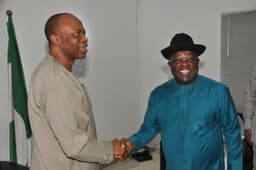 R-L: Governor David Umahi being congratulated on his electoral victory at the Supreme Court by his Ondo State counterpart and Chairman of the Peoples Democratic Party Governors Forum, Dr. Olusegun Mimiko, shortly before the PDP Governors Forum meeting in Abuja . . . on Wednesday night, January 27, 2016. Photo: Ebonyi State Government.