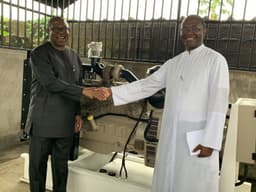 Rector of  Pope John Paul II Major Seminary Awka, Rev.  Fr.  Dr. Cyril Udebunu (right), receiving the 150 KVA Generator donated to the school by the Vice Presidential Candidate of PDP, Mr. Peter Obi, early November 2019 at the seminary premises 