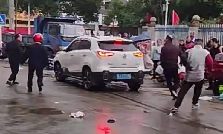 Many children injured as car crashes into school in China