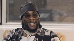 Burna Boy fulfills promise, gifts Cubana Chief Priest’s ‘brother’ $30K