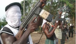 Gunmen kill two policemen, kidnap Chinese national