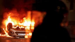 Masked rioters in Northern Ireland attack police, torch houses for second night