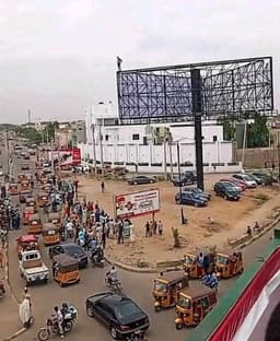 Drama as man climbs billboard in Kano, threatens to kill self over TikTok stars
