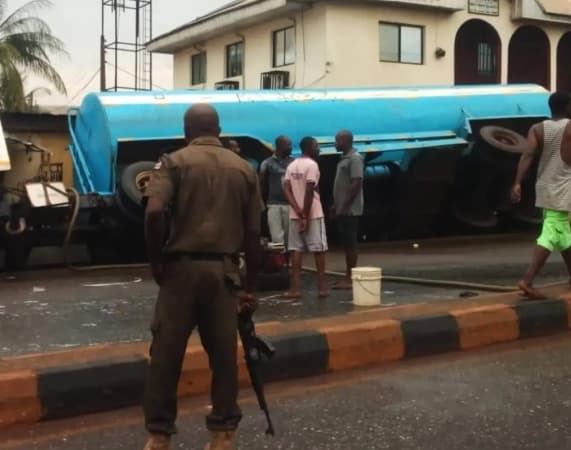 Residents scoop content as diesel-laden tanker falls in Rivers