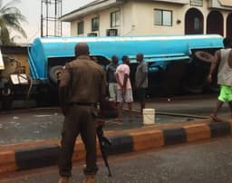 Residents scoop content as diesel-laden tanker falls in Rivers