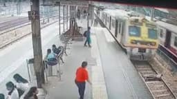 Man jumps on to moving high-speed train