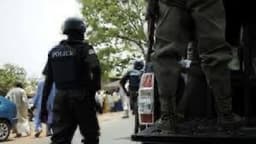 Police escort arrested for killing soldier over truckload of minerals