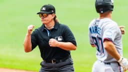 Standing ovation as first female umpire for Major League Baseball takes to the pitch