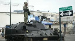 Guard and 13 inmates killed in Ecuador prison fight