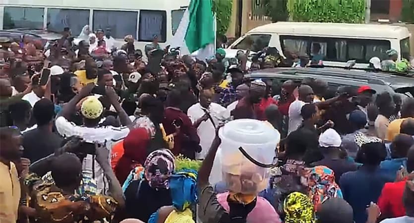 Supporters march with Natasha to celebrate unsealing of her office