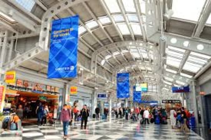 Delays spread to major airports across US, as the seventh day of government shutdown impacts travelers