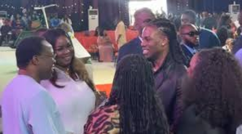 Rema returns to his roots, attends church with his mother in Benin City