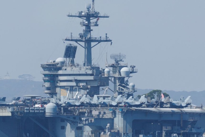 US carrier shoots down Iranian drone as tensions escalate and diplomatic talks hit a snag
