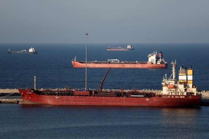 Iran begins laying mines in Strait of Hormuz, sources say