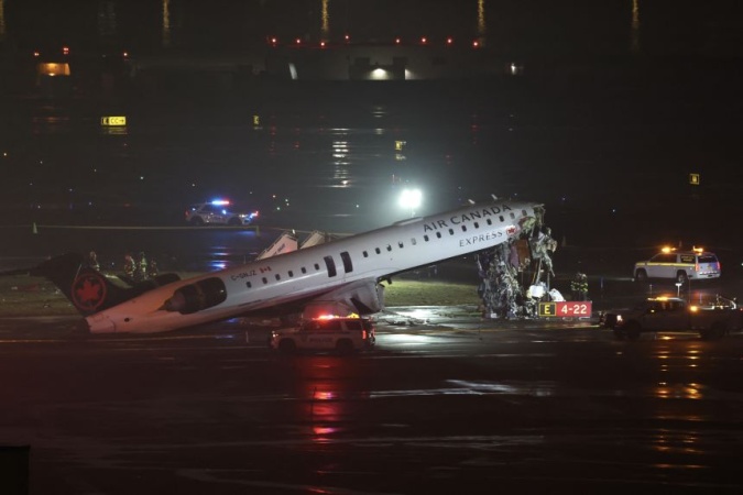 2 killed after Air Canada flight hits fire truck on runway at LaGuardia Airport, source says