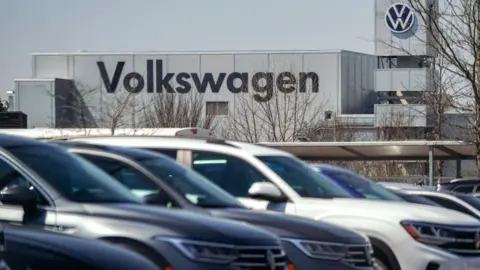 Volkswagen to cut 50,000 jobs as profits drop