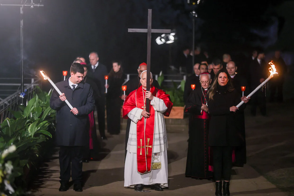 Pope Leo XIV carries cross for entire good friday procession at Rome’s colosseum