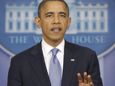 Obama shelves trip as CASH CRUNCH HITS AMERICA