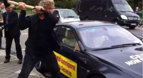 Angry man smashes his Â£100,000 (about N26 million) BMW with a SLEDGEHAMMER in protest over poor customer service