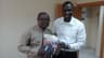 Isaac Umunna and Kudo Eresia-Eke, Ph.D display a copy of NLNG Magazine.