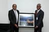 Managing Director, Shell Nigeria Gas, Ed Ubong (left) making a presentation to the Managing Director, Nigerian Gas Marketing Company, Mr. Ahmed Muhammed Abdulkabir, during a visit to Abdulkabir in Abuja... recently.