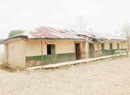 Wike must hear this: Pupils sit on bare floor, teachers on window in Abuja school