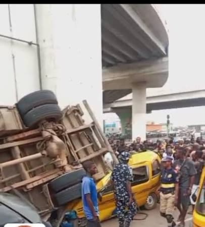 Driver severely injured as truck falls off bridge in Lagos