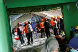 Over 90 people believed buried under rubble after Indonesia school collapse