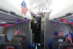 Obama surprises dozens of veterans after their plane arrives in Washington for Veterans Day