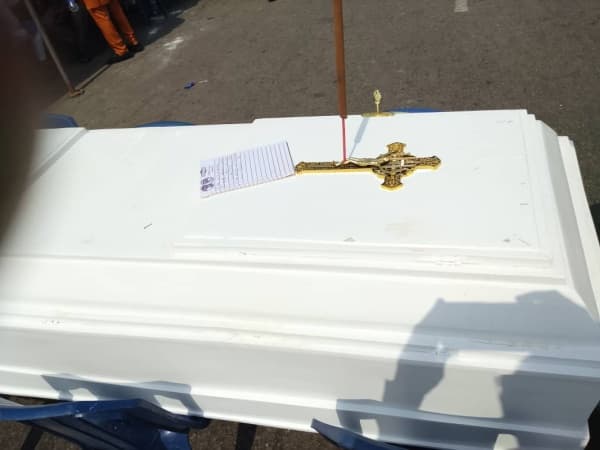 JUST IN: Protesting contractors lay coffin in front of Finance Ministry