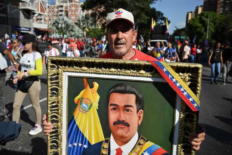 Thousands march in Venezuela to demand US free President Maduro, wife